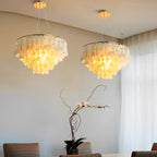 Round shell disc chandelier shown from another angle