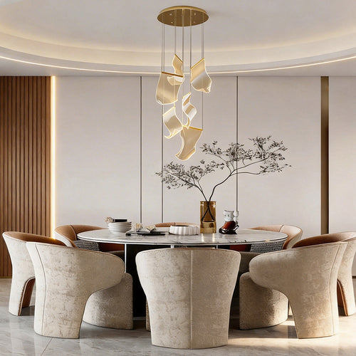 Acrylic ribbon chandelier above a luxurious dining table