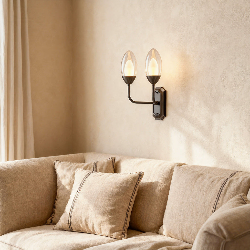 Glass wall light in a neutral living room with warm light