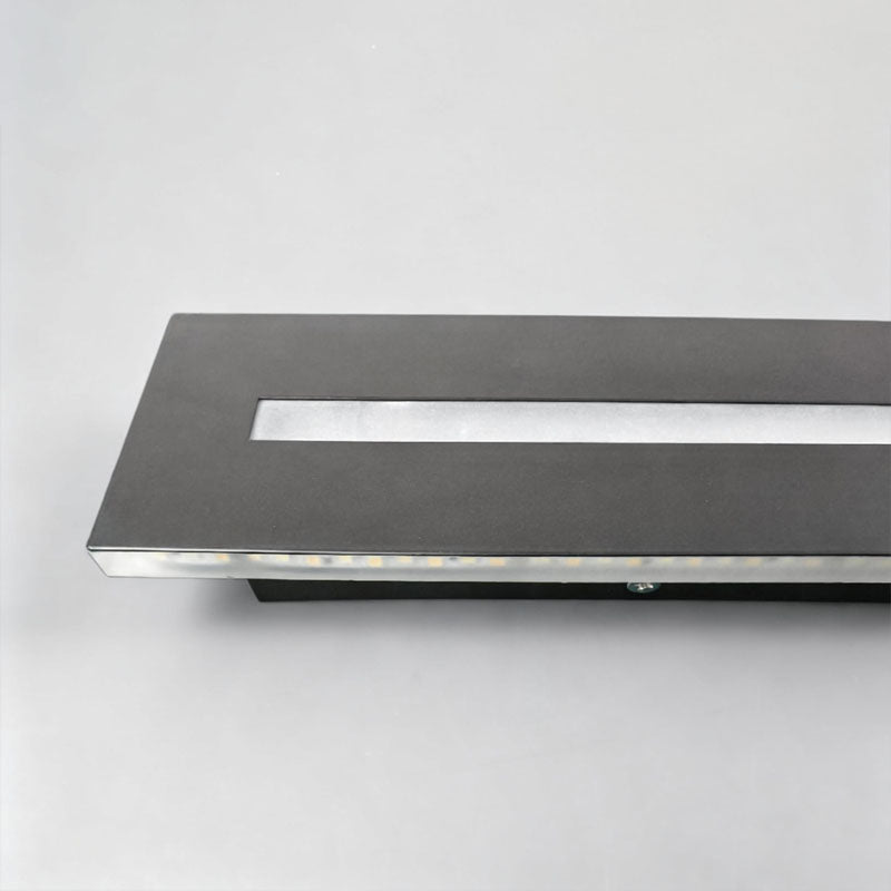 Long black wall sconce showing its matte architectural finish