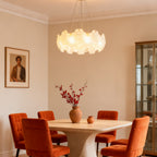 Artistic glass chandelier in a dark themed living room