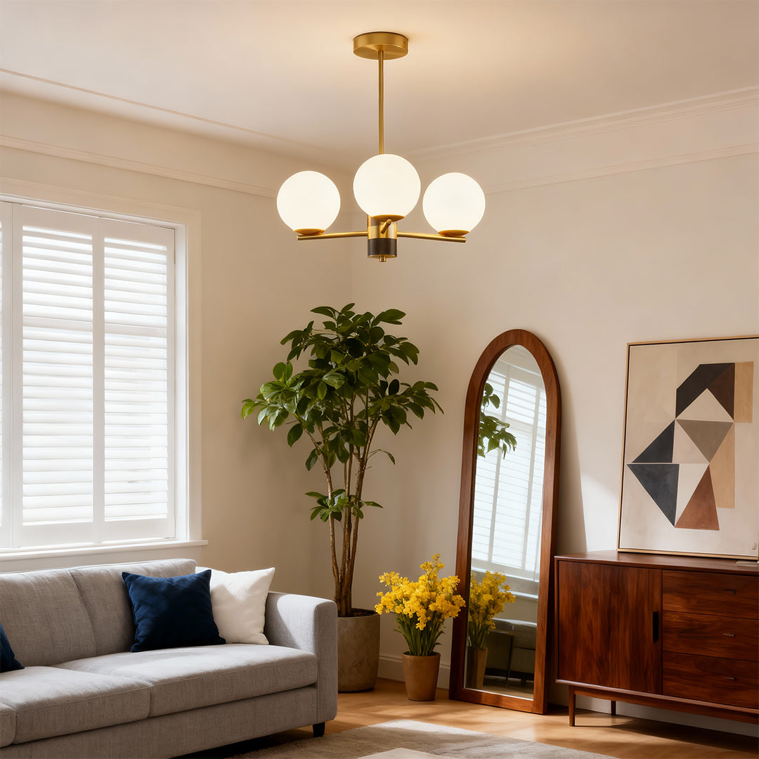 Sculptural chandelier in an elegant living room with a leather sofa