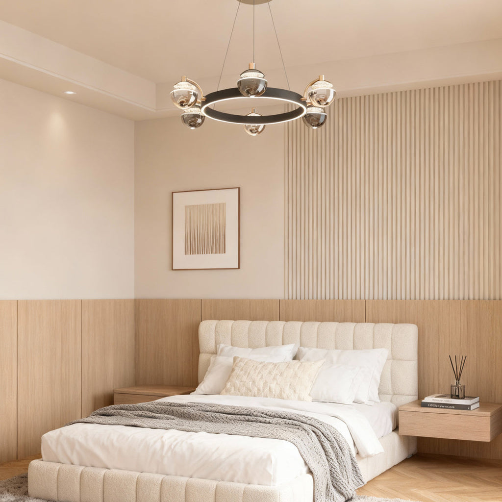 Black and gold chandelier in a bedroom with a wood slat wall