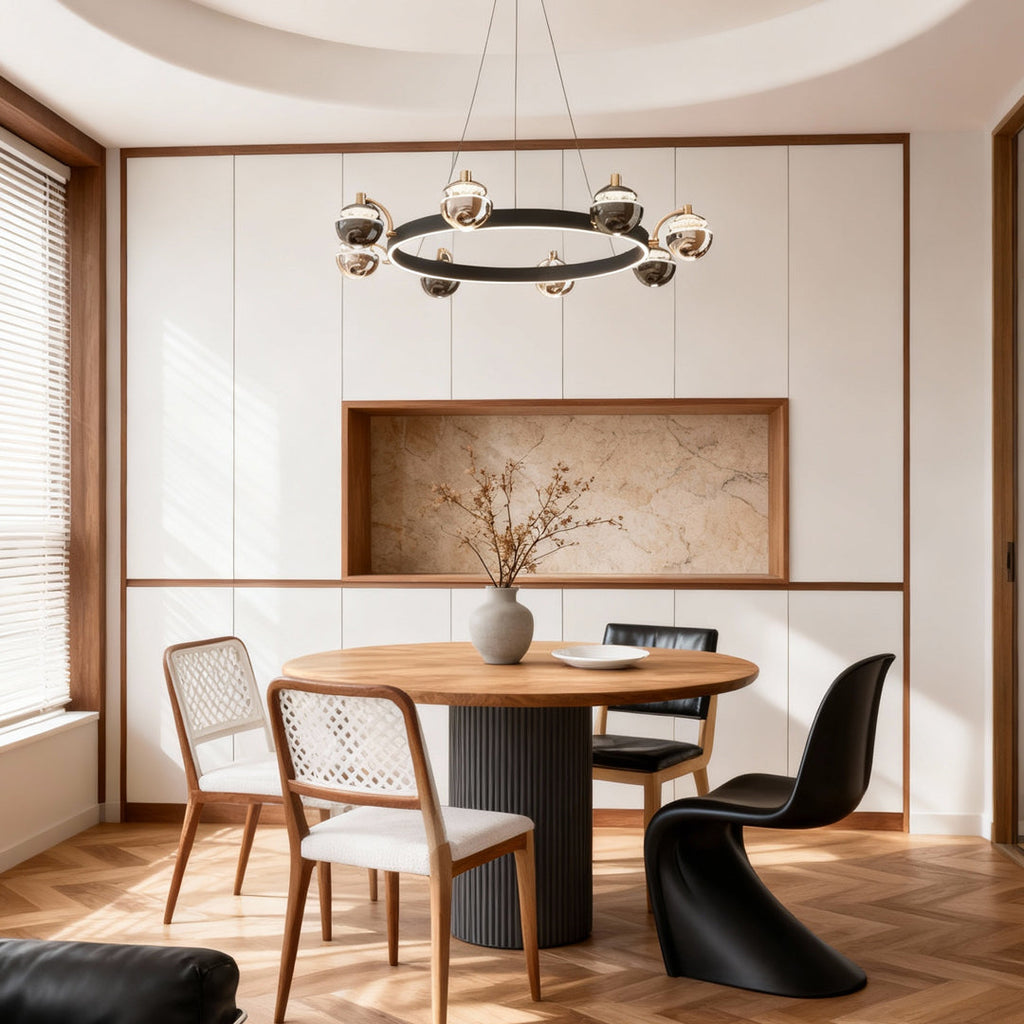 Black and gold chandelier above a minimalist dining table