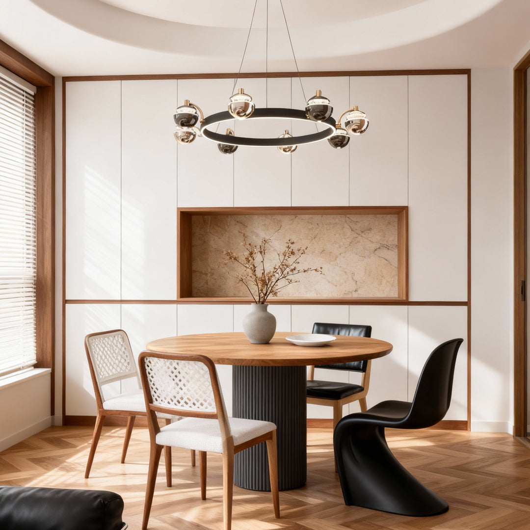 Black and gold chandelier above a minimalist dining table