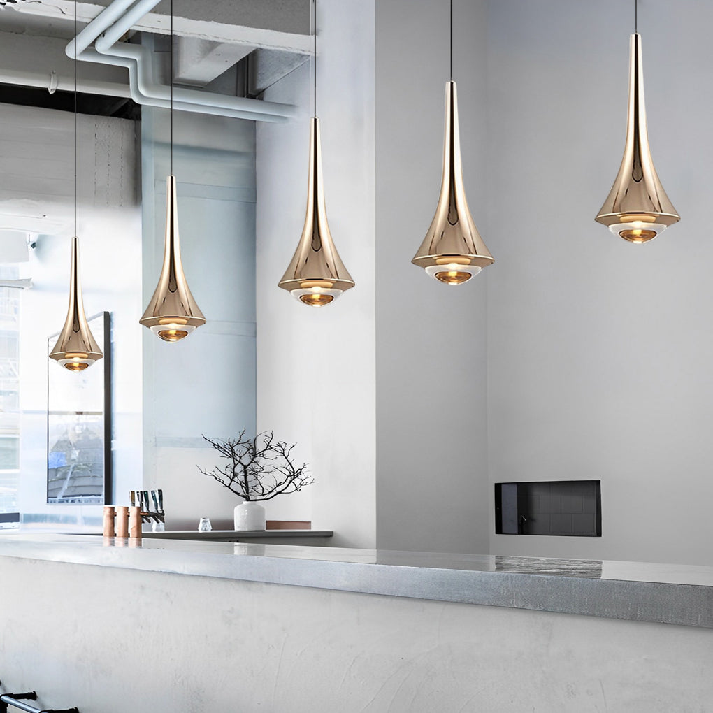 Metallic cone pendant lights above a dining table
