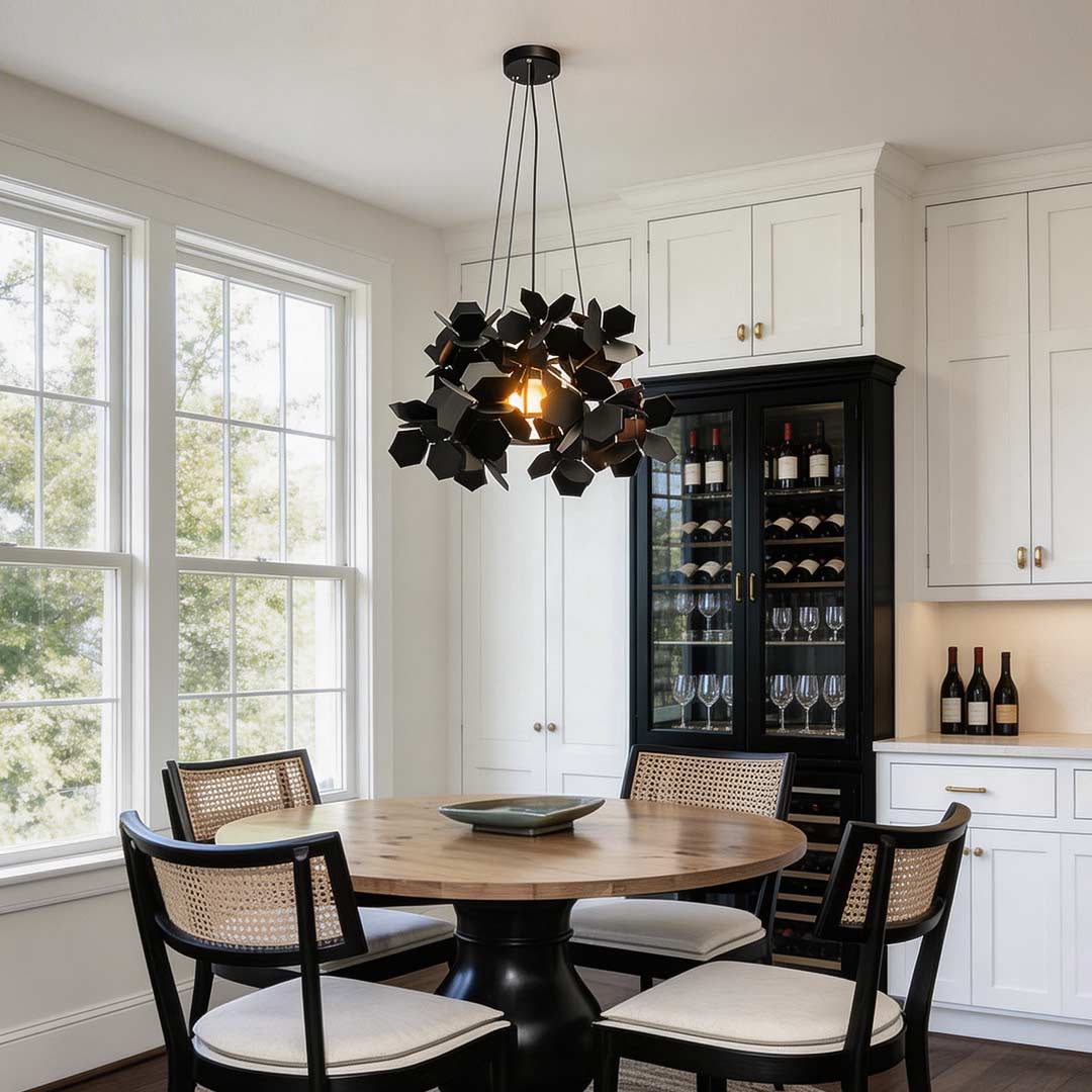 Black leaf chandelier hanging in a contemporary dining room