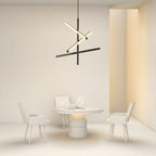 Black iron chandelier as the focal point of a bright dining room