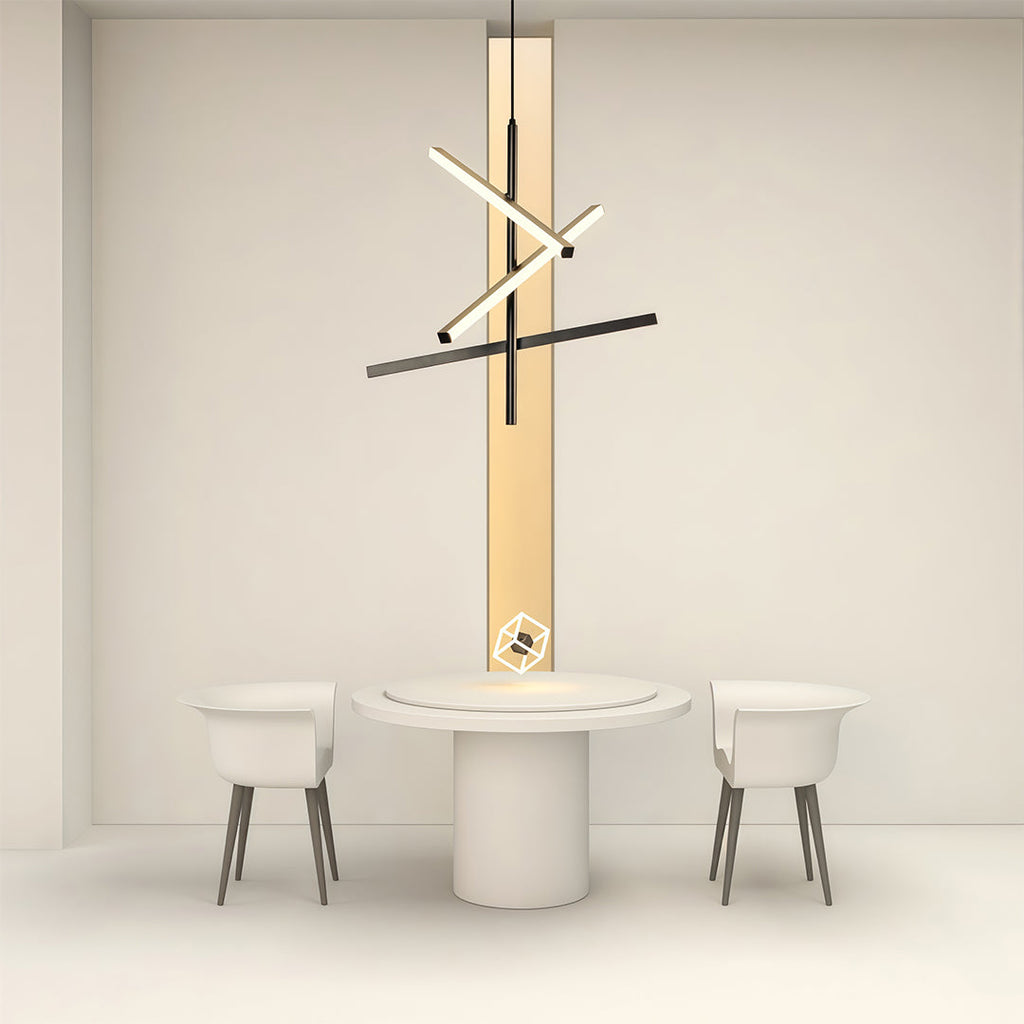 Black iron linear chandelier above a round white dining table