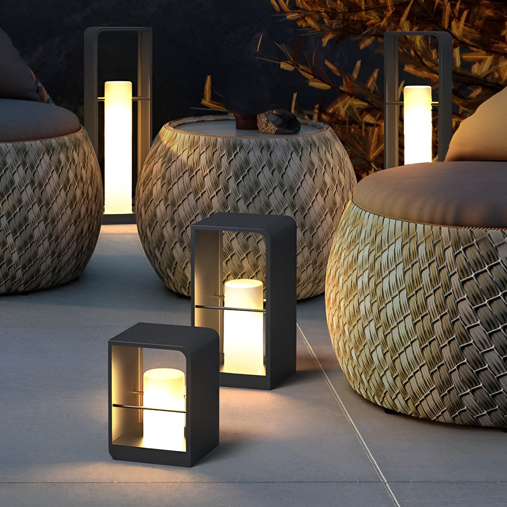 Black lantern casting soft light over poolside furniture