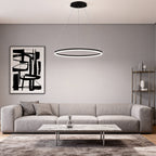 Black LED ring chandelier above a gray sofa interior