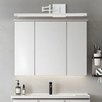 Black linear vanity light in a minimal bathroom
