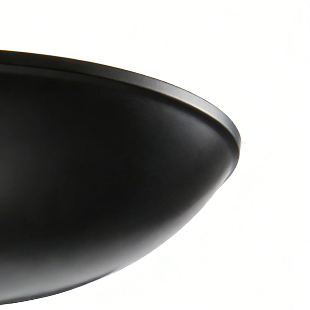 Detail of the black metal shade on the chandelier