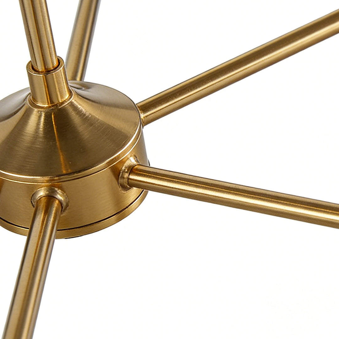 Detail of the gold metal arm on the chandelier