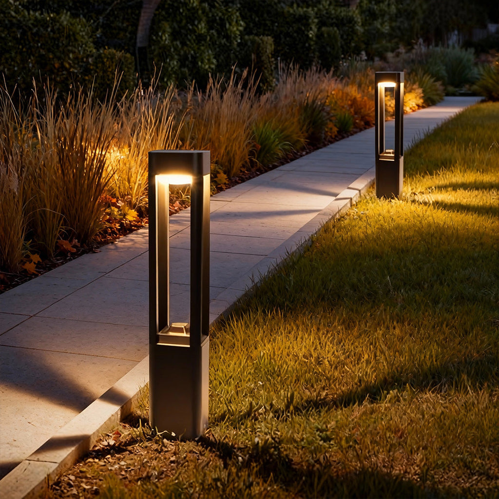 Bollard lights along a curved walkway at night