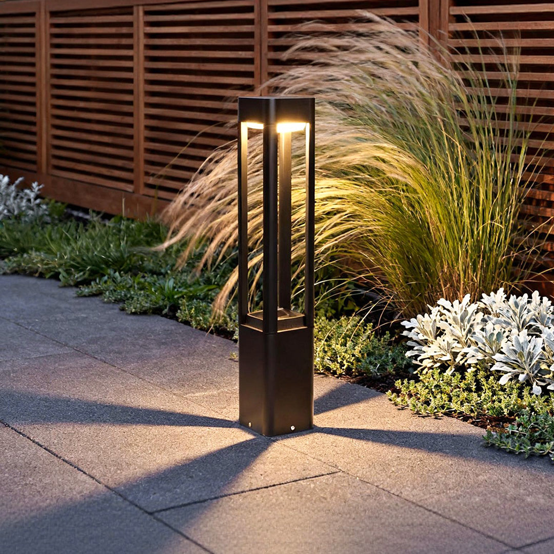 Bollard landscape lights lining a modern garden path