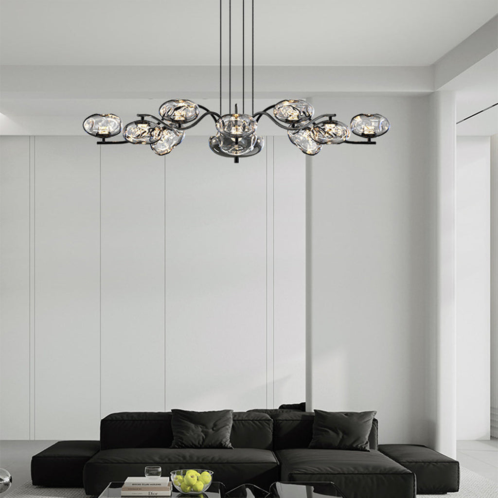 Brass finish LED chandelier in a horizontal arrangement