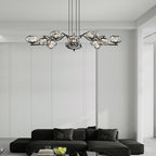 Brass finish LED chandelier in a horizontal arrangement