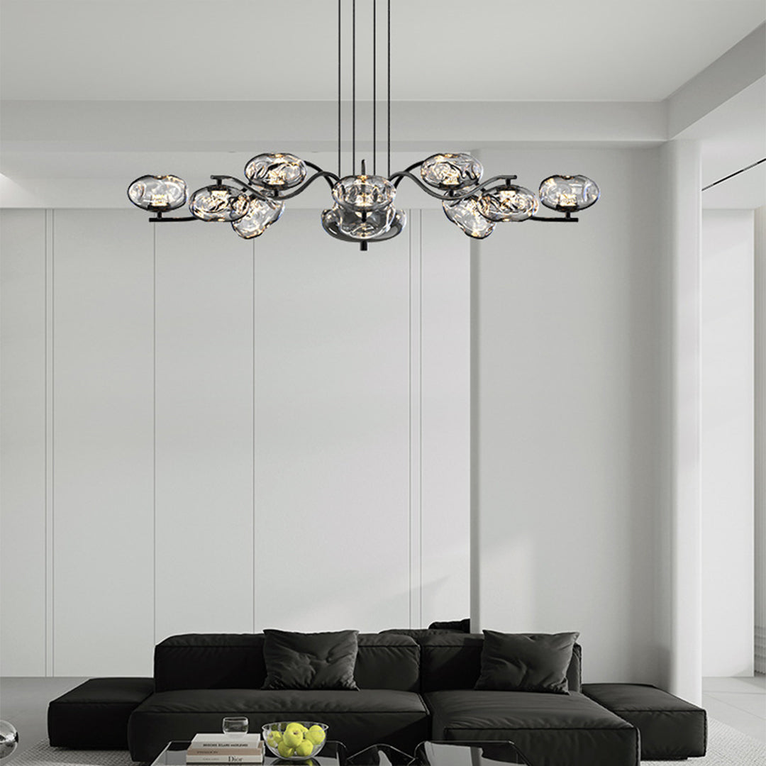 Brass finish LED chandelier in a horizontal arrangement