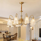 Vintage brass chandelier hanging in a classic dining room