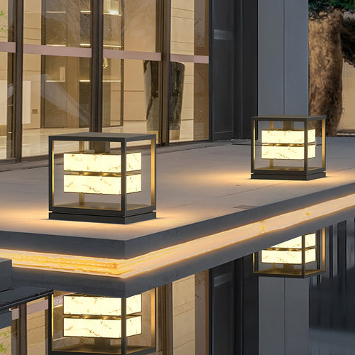 Brick pillar solar light beside a patio deck