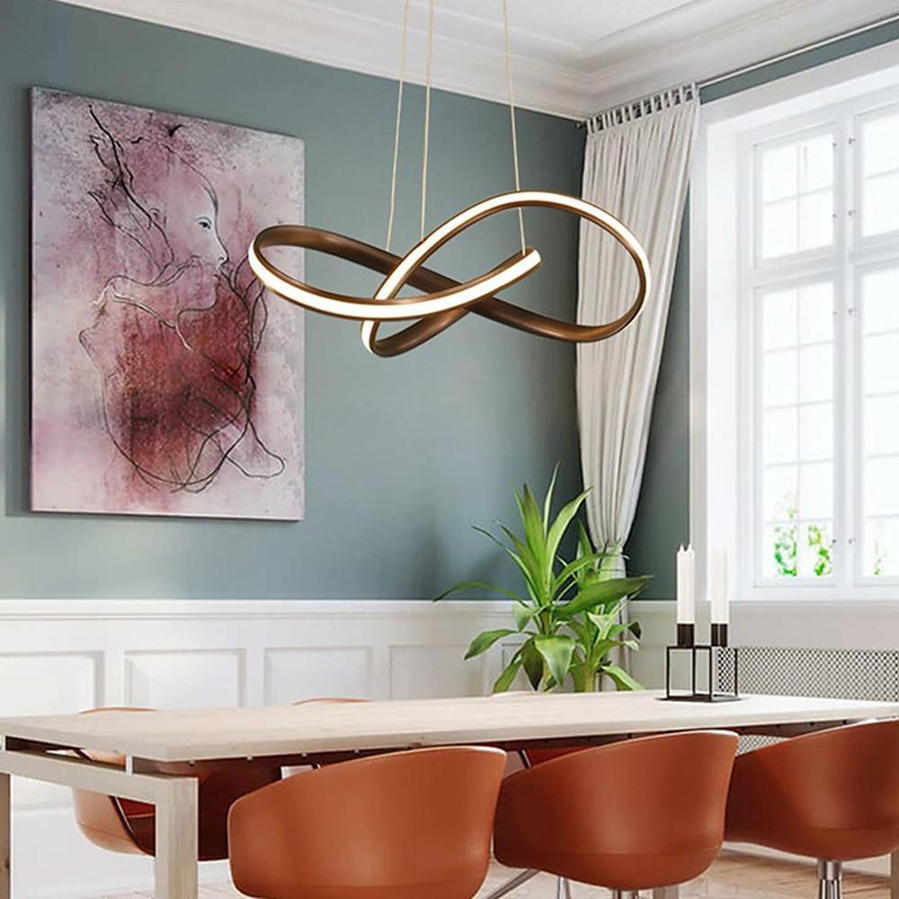 Mobius ring pendant light hanging above a kitchen