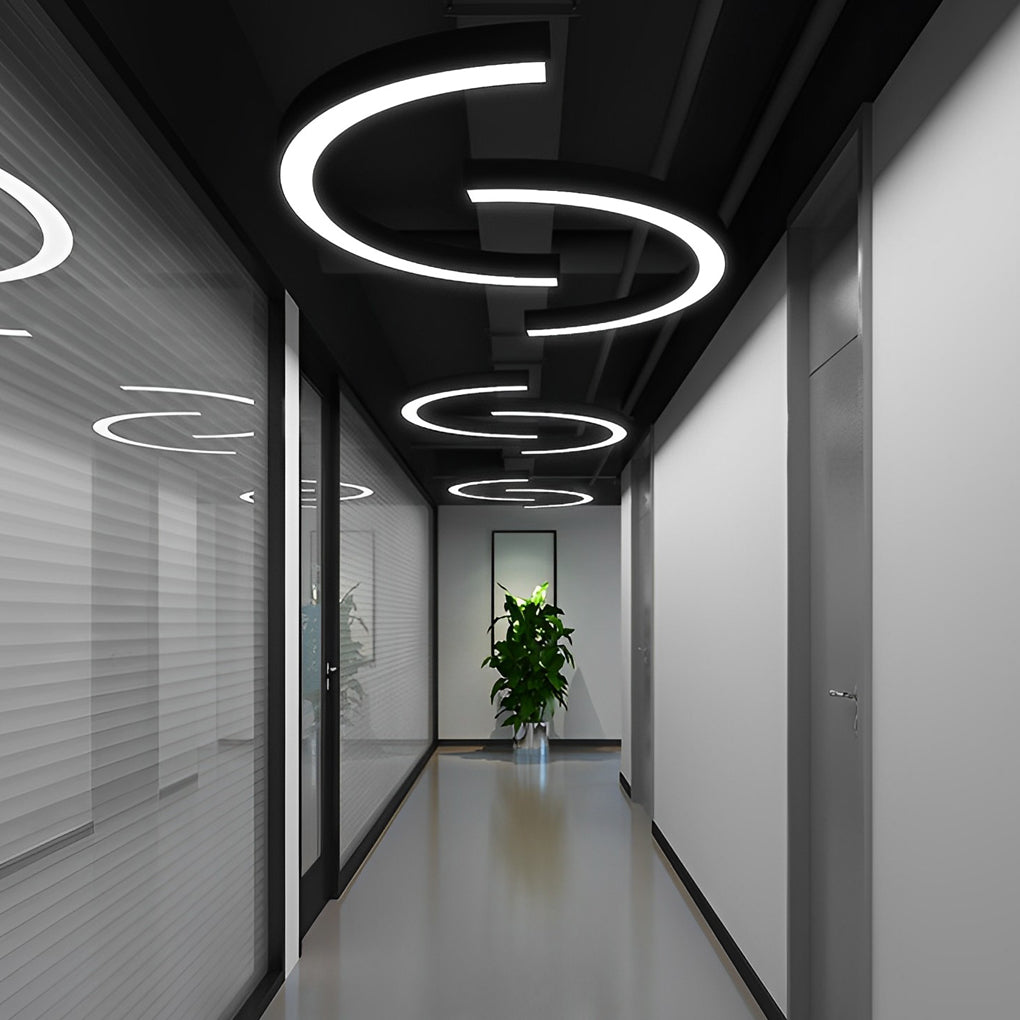 C-shaped pendant lights hanging in a contemporary hallway