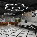C-shaped pendant lights hanging above a creative workspace
