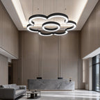 C-shaped pendant lights hanging from a hotel lobby ceiling