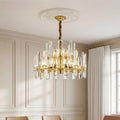 Brass chandelier with staggered crystal prisms