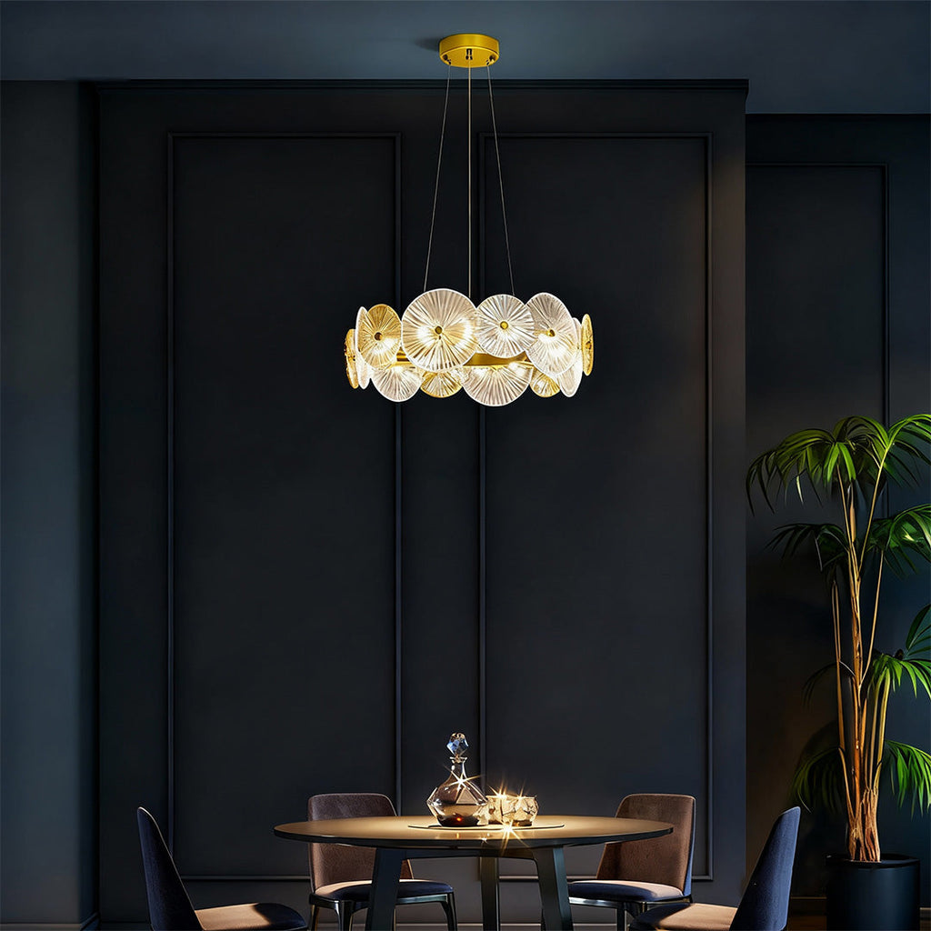 Large glass chandelier hanging in a chic dining room