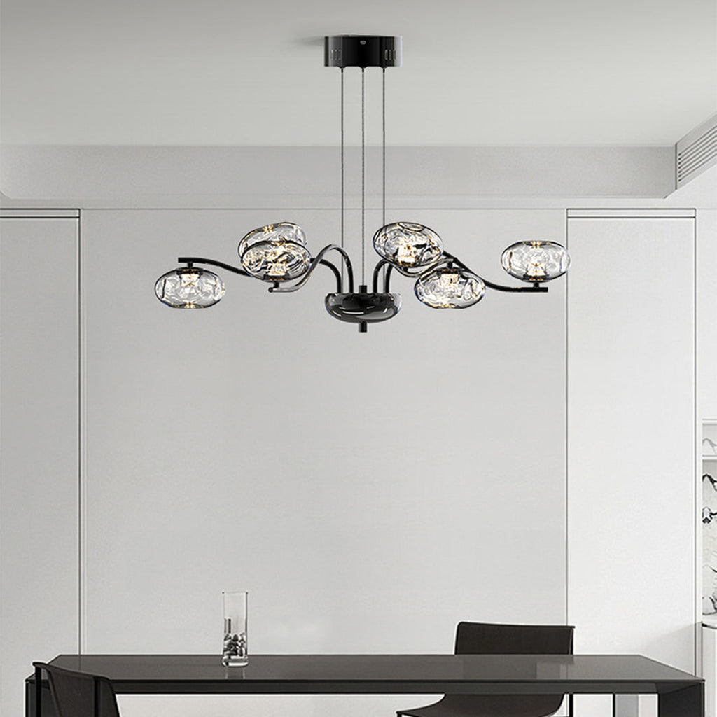 Chrome finish LED chandelier in a minimalist white room