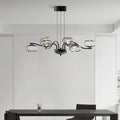 Chrome finish LED chandelier in a minimalist white room