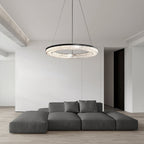 Contemporary LED ring pendant hanging above a dining table