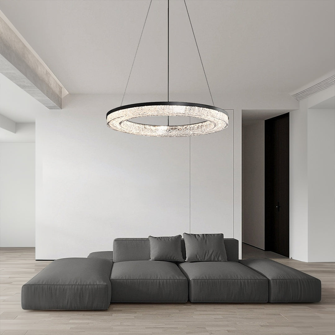 Contemporary LED ring pendant hanging above a dining table