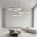 Copper circle pendant light above a cozy seating area