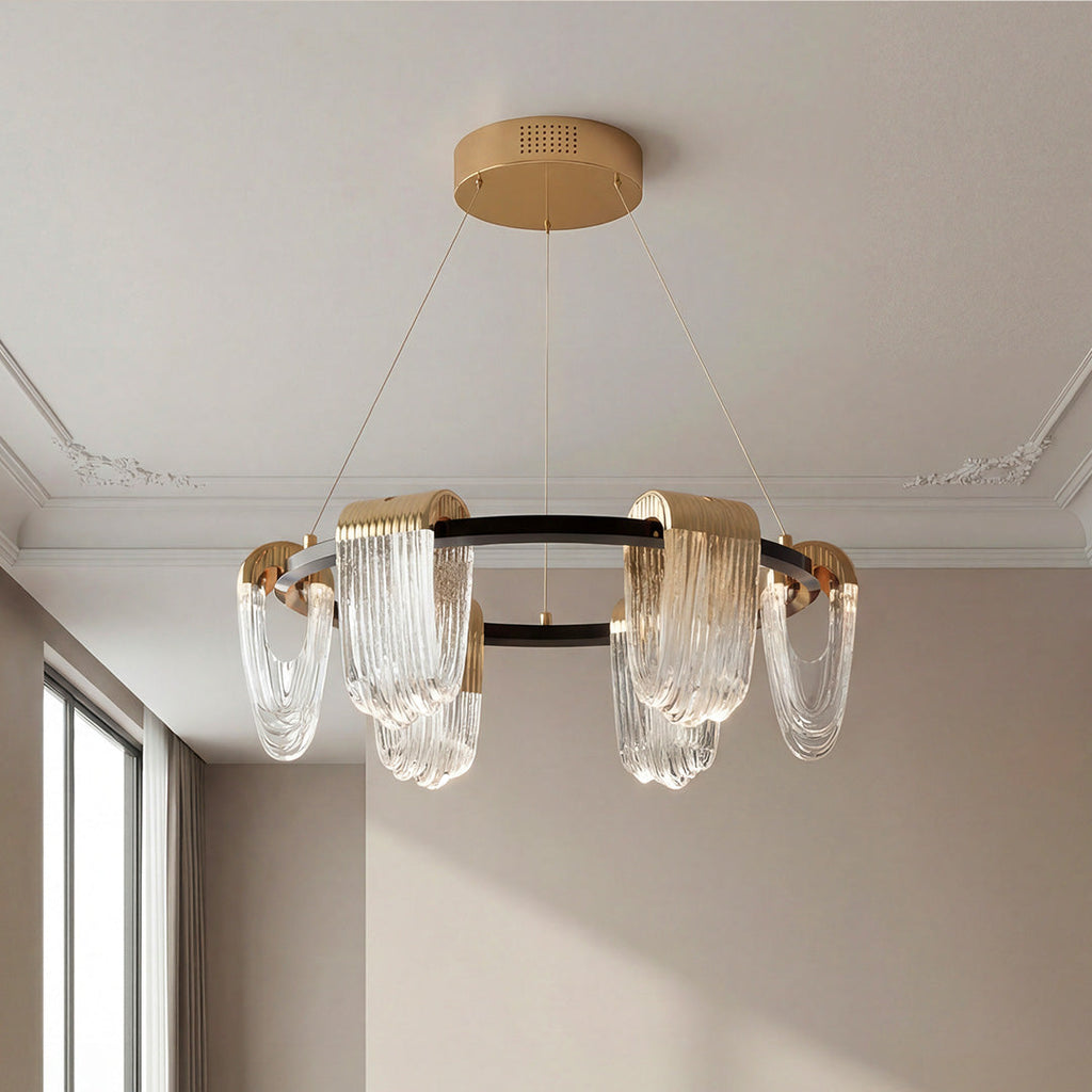 Black and gold circular chandelier with draped glass