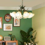Close-up of the white floral shades on the chandelier