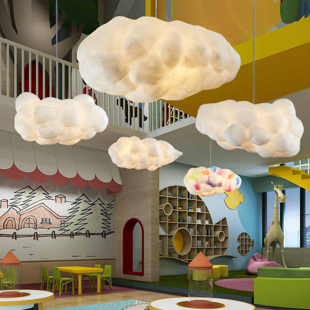 Cluster of cloud pendant lights over an indoor playground