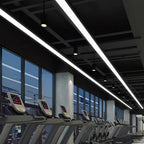 Linear pendant lights lighting a fitness center floor