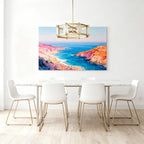 Round chandelier in a minimalist white dining room with coastal painting