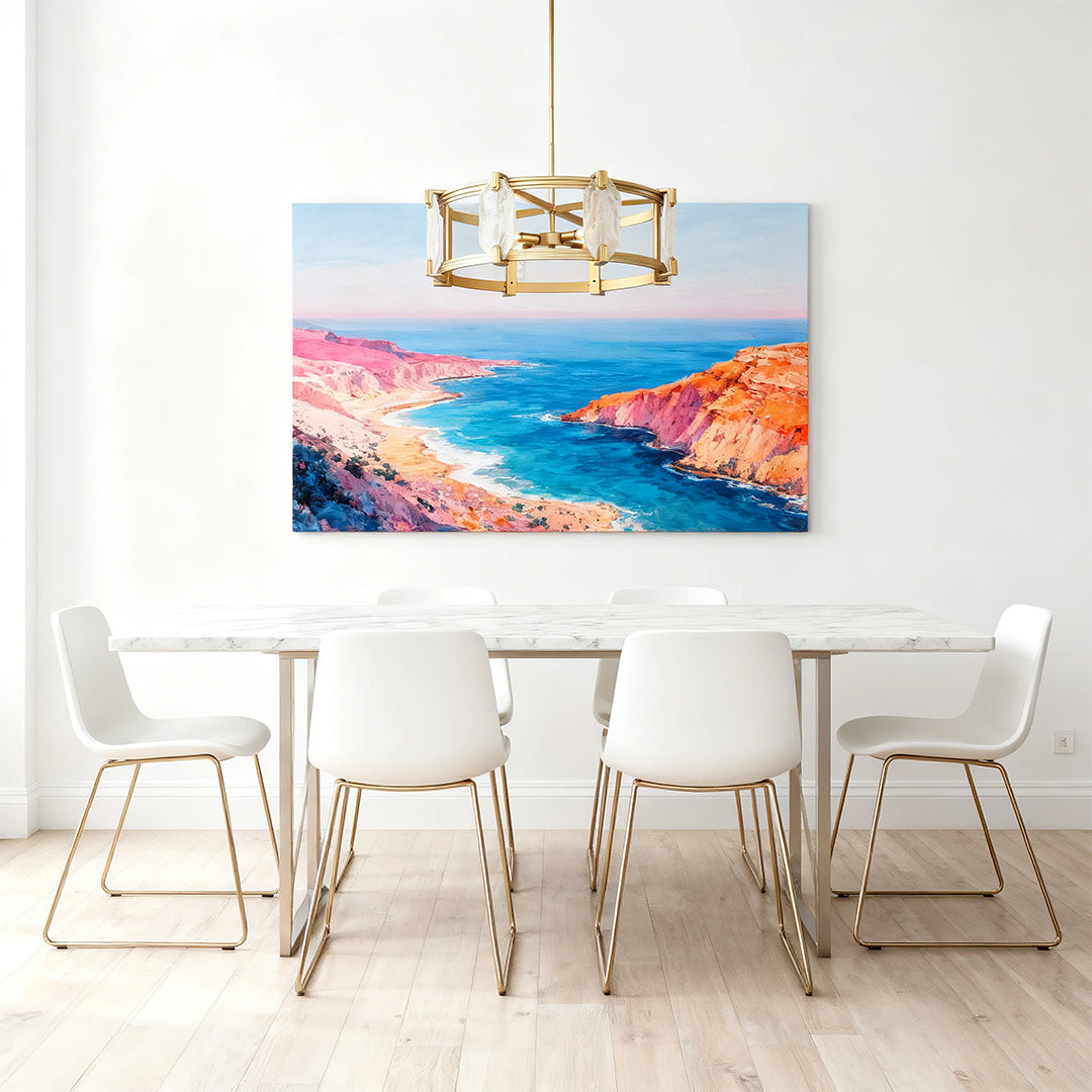 Round chandelier in a minimalist white dining room with coastal painting