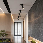 Minimalist directional surface spotlight in a contemporary hallway