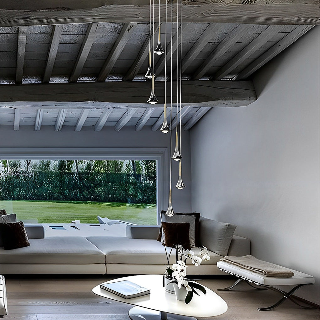 Teardrop mini pendant lights hanging in an open living space