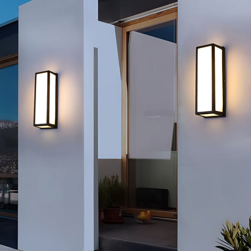 Black contemporary wall light mounted on a modern exterior wall
