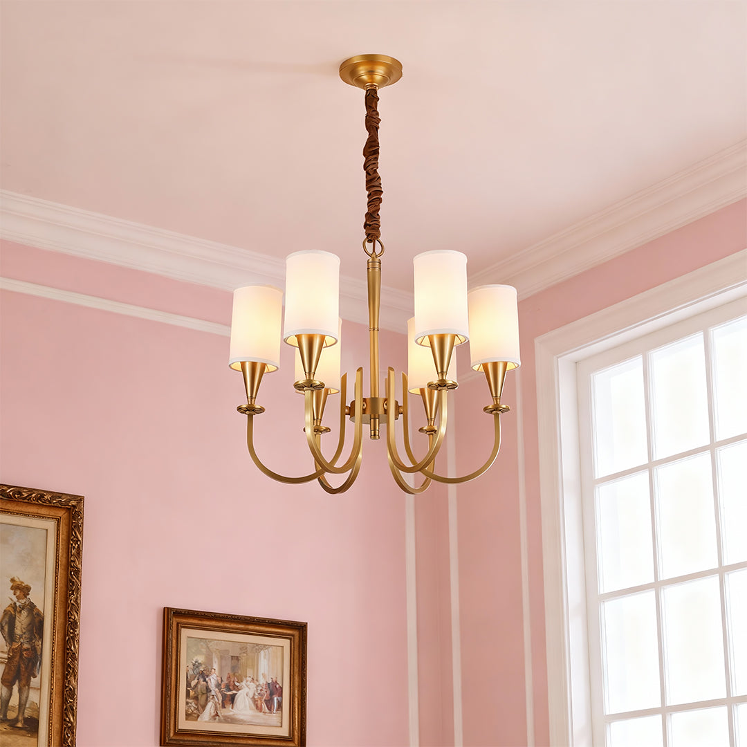 Copper chandelier hanging in a romantic pink dining room