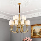Copper chandelier hanging below a grey ornate ceiling