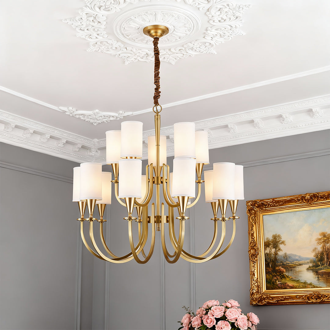 Copper chandelier hanging below a grey ornate ceiling