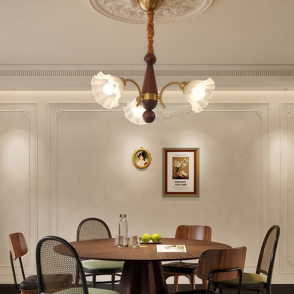 Five-flower chandelier in a kitchen with wood cabinetry