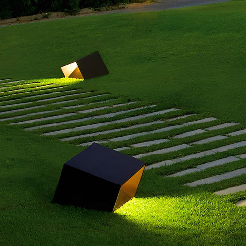 Waterproof cube path light standing in an outdoor landscape